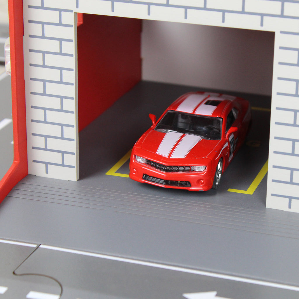 Toy garage with sectional roll-up doors and garage door opener, toy car storage, toy car service station
