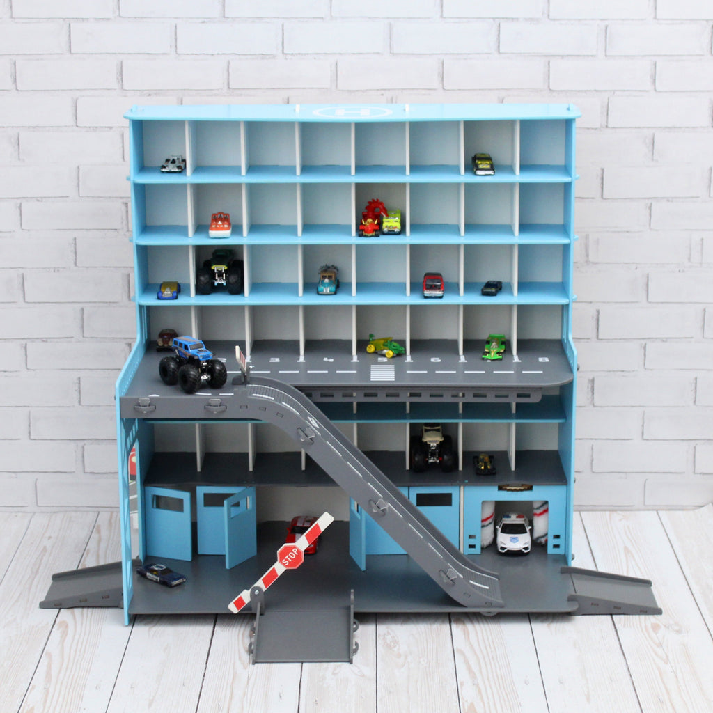 Toy car garage in light blue with light and inscription