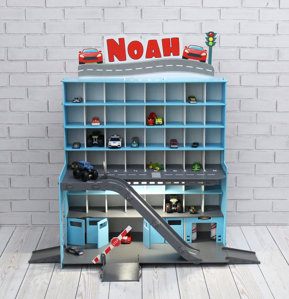 Toy car garage in light blue with light and inscription