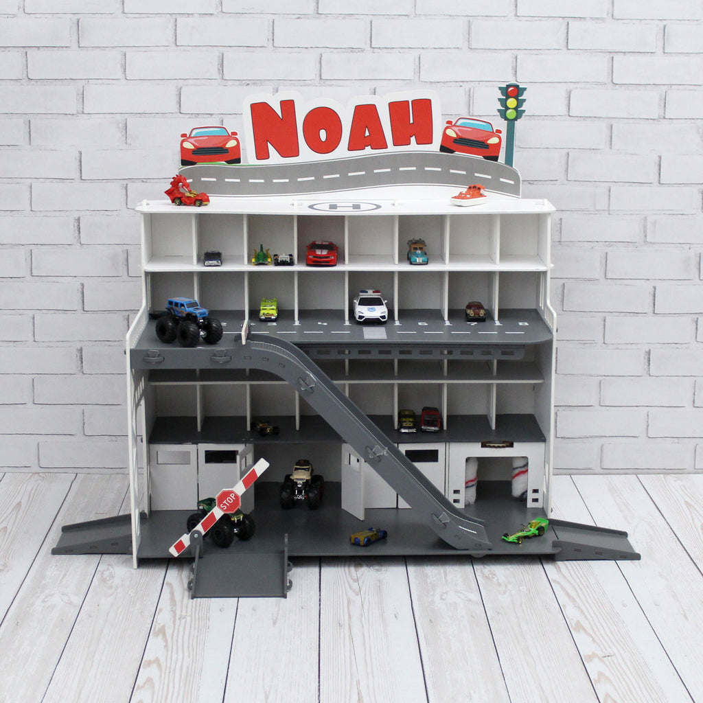 Toy car garage with interactive toy car wash, motion detection activated and inscription with chid's name in white