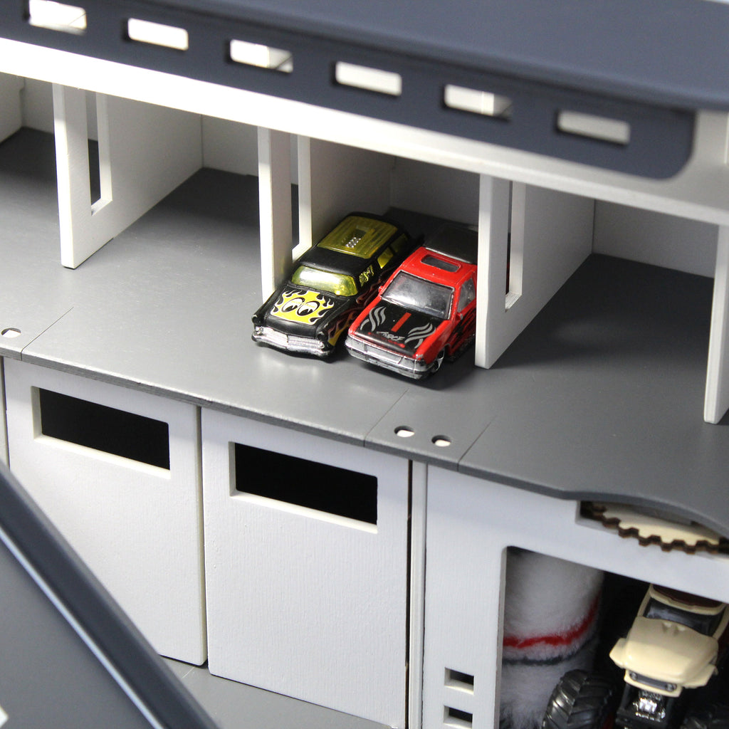 Toy car garage with interactive toy car wash, motion detection activated and inscription with chid's name in white