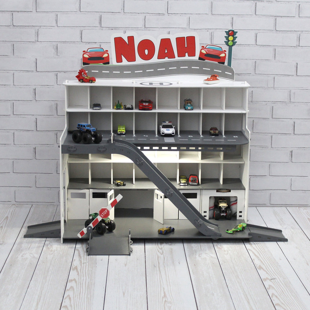 Toy car garage with interactive toy car wash, motion detection activated and inscription with chid's name in white