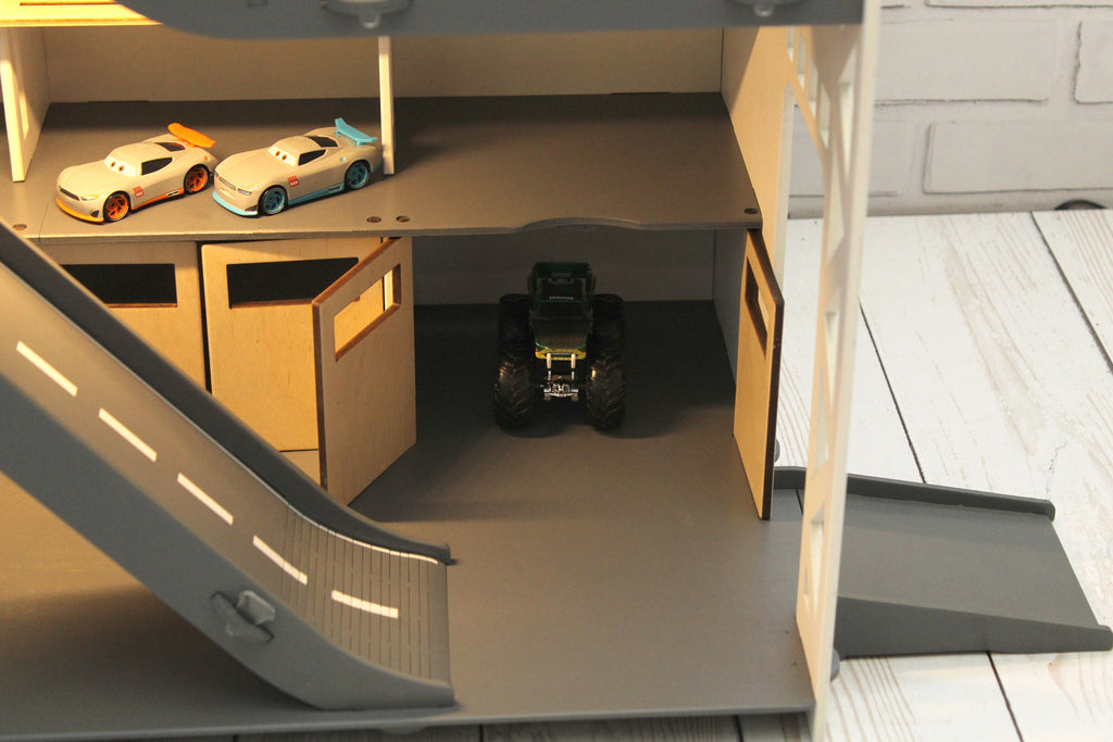 Toy car garage with a toy car wash, doors, gates and mutiple ramps