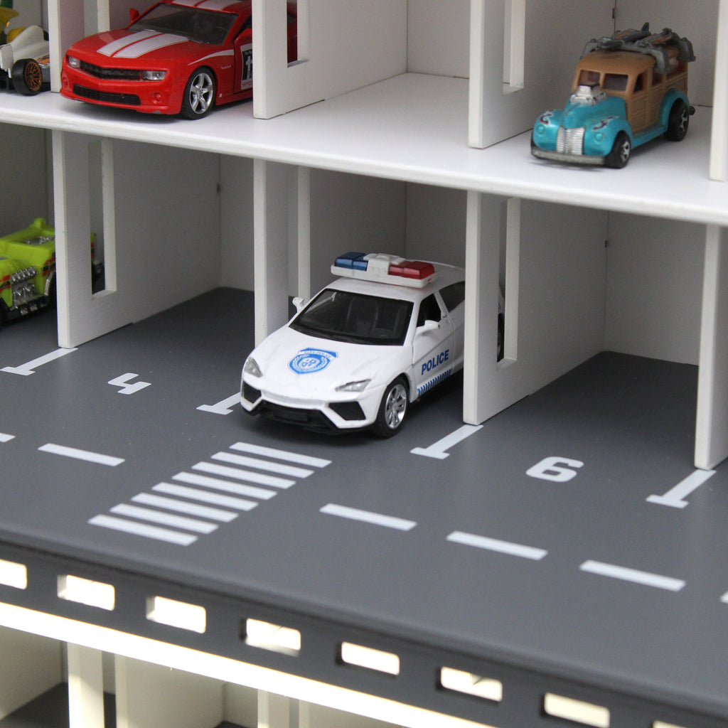 Toy car garage with a toy car wash, doors, gates and mutiple ramps in white
