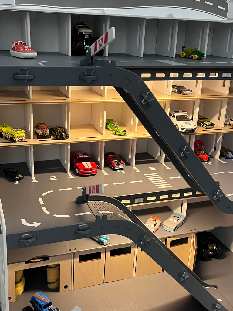 Toy car garage with a toy car wash, doors, gates and mutiple ramps in white