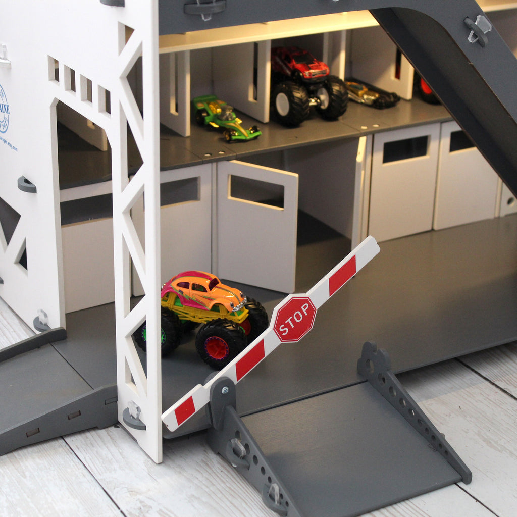 Toy Car Garage has multiple ramps, gates, barries and doors