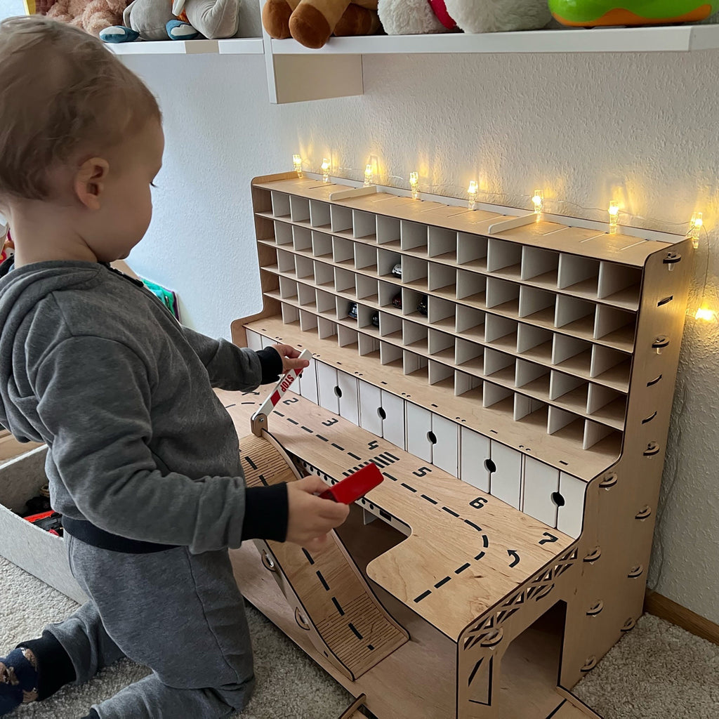 wooden toy garage with doors and ramps