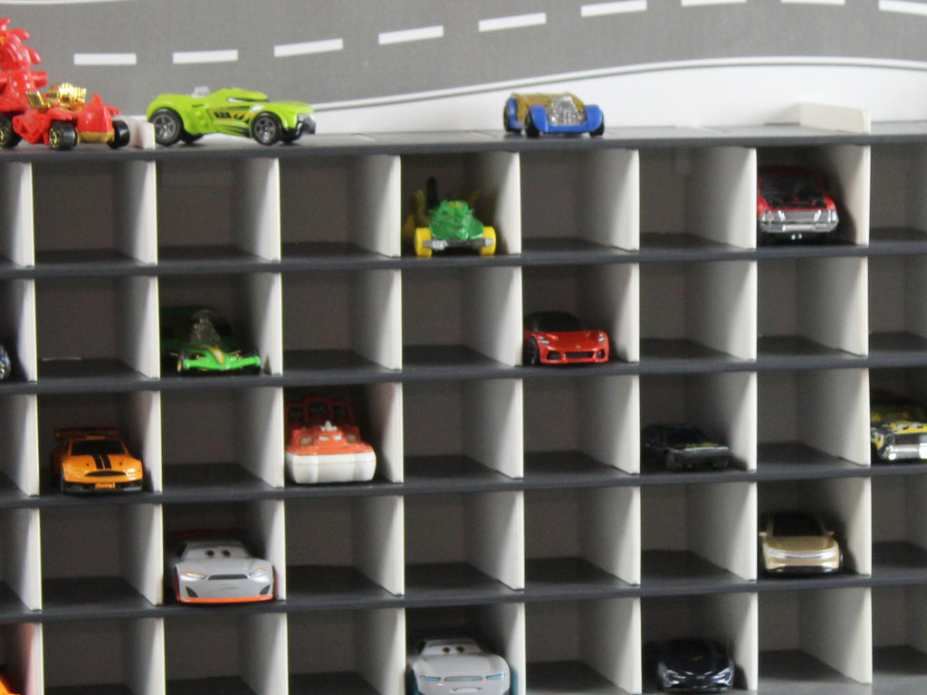 Interior of the toy garage showcasing a colorful collection of 1:64 scale toy cars.