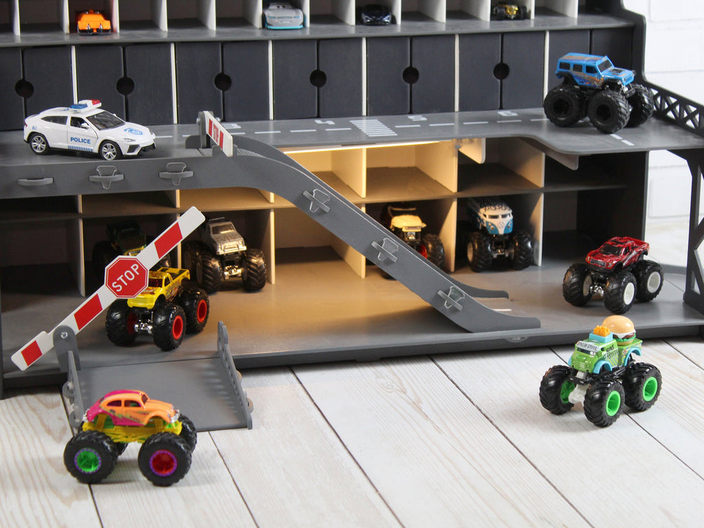 Toy garage with a placed by child a toy car on different levels
