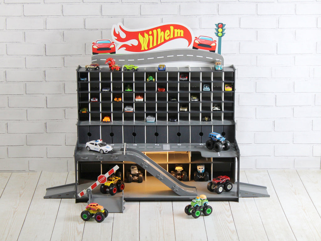 Front view of Personalized Wooden Toy Garage with a child&#39;s name engraved on the top
