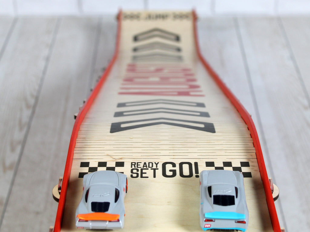 An action shot of a toy car jumping off the ramp, showcasing its exciting play potential.