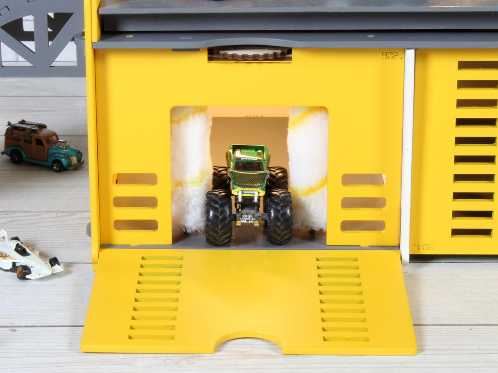 Interactive wooden toy garage with a toy car wash, ideal for imaginative play