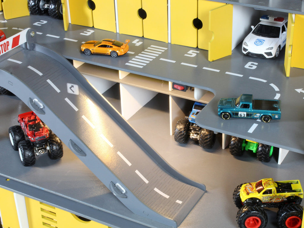 Toy car garage designed to spark creativity and storytelling in young boys